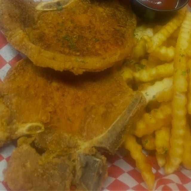 2 Bone in Pork Chop with Fries.